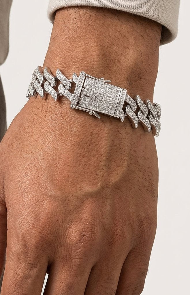Silver link bracelet worn on a wrist in bright daylight